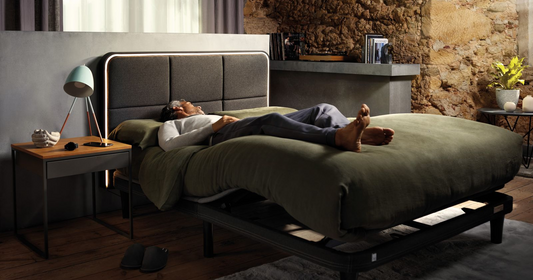 Man sleeping with legs elevated in the ErgoSportive bed